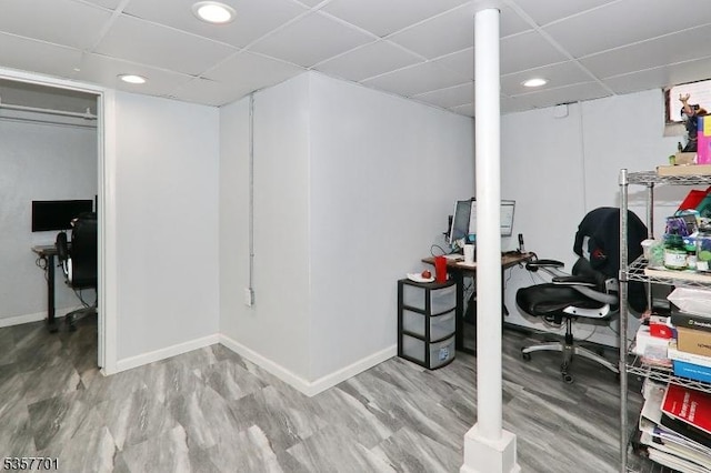 office space featuring a paneled ceiling, recessed lighting, and baseboards