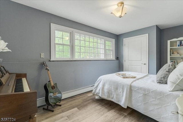1011 Stillwater Rd, Stillwater Twp, NJ 07860 - bedroom with wood finished floors and a baseboard heating unit
