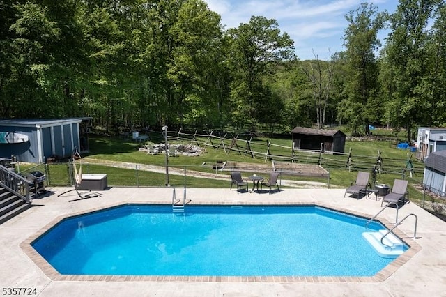 1011 Stillwater Rd, Stillwater Twp, NJ 07860 - view of pool featuring a storage unit, an outbuilding, and a patio area