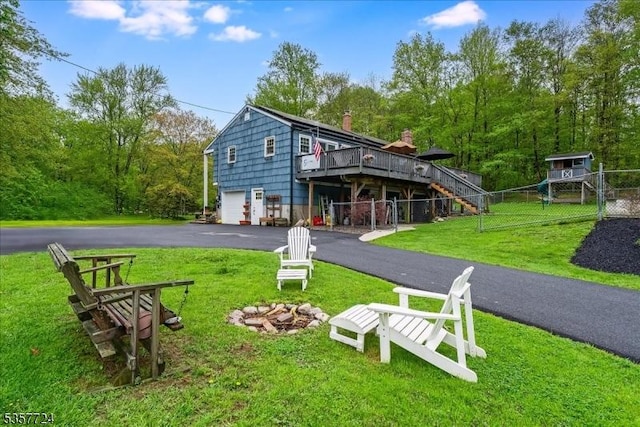 1011 Stillwater Rd, Stillwater Twp, NJ 07860 - back of property with driveway, an attached garage, a deck, and a chimney