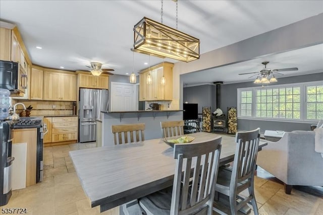 1011 Stillwater Rd, Stillwater Twp, NJ 07860 - dining room featuring a ceiling fan, a wood stove, and recessed lighting