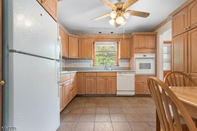 3 Red Maple Ln, Kenilworth Boro, NJ 07033 - kitchen featuring white appliances, tasteful backsplash, light countertops, a ceiling fan, and a sink