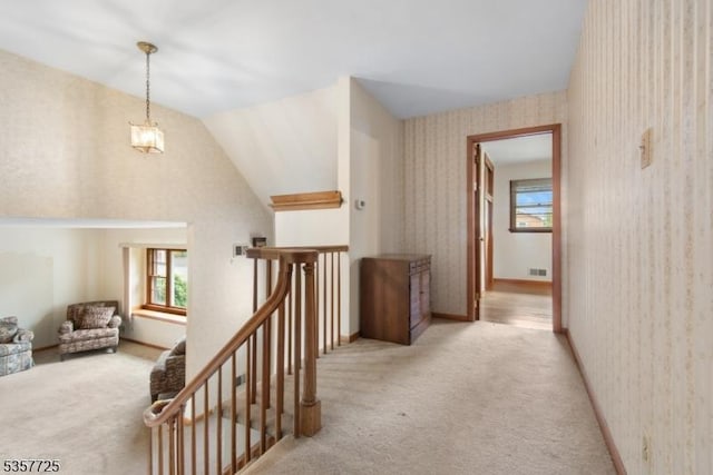 3 Red Maple Ln, Kenilworth Boro, NJ 07033 - corridor with carpet floors, wallpapered walls, vaulted ceiling, and an upstairs landing