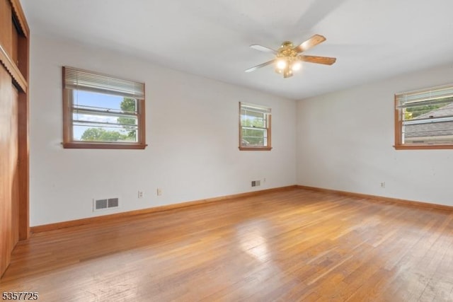 3 Red Maple Ln, Kenilworth Boro, NJ 07033 - unfurnished bedroom with light wood-type flooring, baseboards, ceiling fan, and a closet