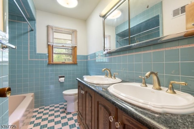 3 Red Maple Ln, Kenilworth Boro, NJ 07033 - bathroom featuring tile walls, toilet, double vanity, bathing tub / shower combination, and wainscoting