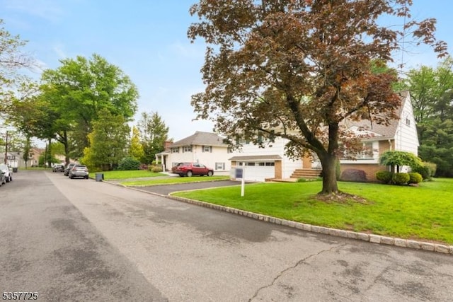 3 Red Maple Ln, Kenilworth Boro, NJ 07033 - view of front of property featuring a front yard and asphalt driveway
