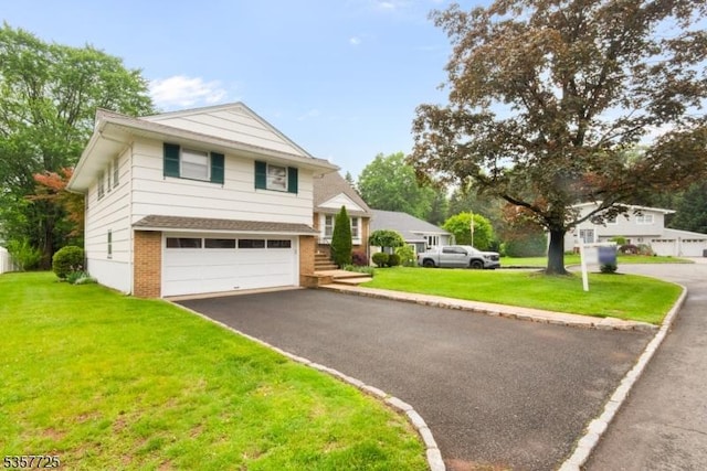 3 Red Maple Ln, Kenilworth Boro, NJ 07033 - tri-level home featuring brick siding, asphalt driveway, an attached garage, and a front yard