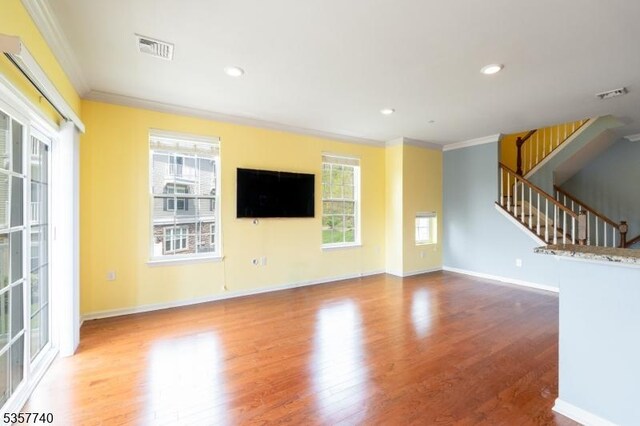 302 Waterview Ct, Hanover Twp, NJ 07927 - unfurnished living room featuring crown molding, wood finished floors, healthy amount of natural light, stairs, and baseboards
