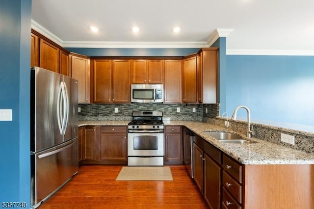 302 Waterview Ct, Hanover Twp, NJ 07927 - kitchen featuring stainless steel appliances, a sink, crown molding, light stone countertops, and a peninsula