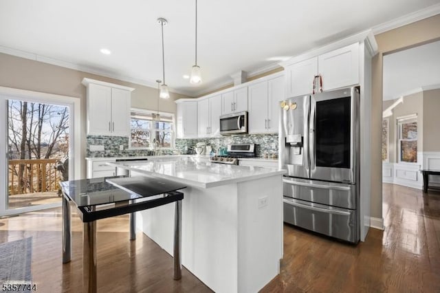 783 Aborn Ave, Woodbridge Twp, NJ 07095 - kitchen with appliances with stainless steel finishes, crown molding, a center island, white cabinetry, and dark wood-type flooring