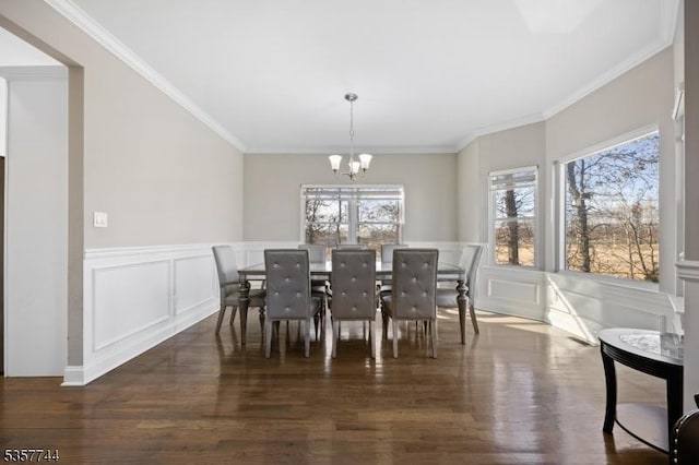 783 Aborn Ave, Woodbridge Twp, NJ 07095 - dining space with a chandelier, a decorative wall, wood finished floors, wainscoting, and ornamental molding