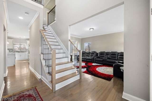 783 Aborn Ave, Woodbridge Twp, NJ 07095 - stairs featuring ornamental molding, wood finished floors, and baseboards