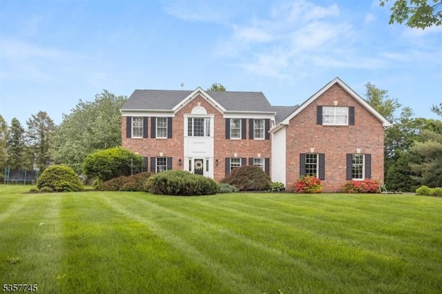 4 Rachel Ct, Greenwich Twp, NJ 08886 - colonial-style house featuring brick siding and a front lawn
