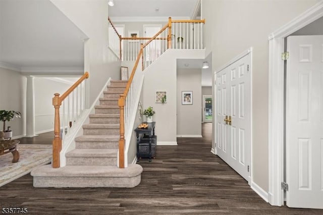 4 Rachel Ct, Greenwich Twp, NJ 08886 - foyer featuring dark wood-style flooring, stairs, ornamental molding, a high ceiling, and baseboards