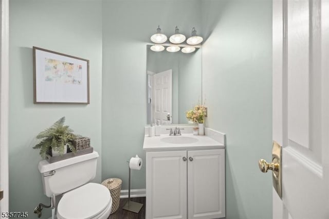 4 Rachel Ct, Greenwich Twp, NJ 08886 - bathroom with toilet, vanity, baseboards, and wood finished floors