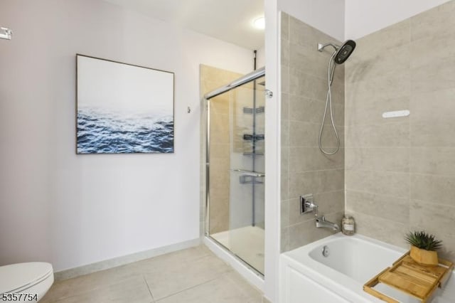 201 Marin Blvd Unit 1507, Jersey City, NJ 07302 - bathroom featuring tiled shower, tile patterned floors, a bathtub, toilet, and baseboards
