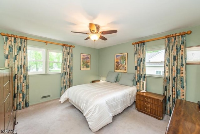 carpeted bedroom featuring a ceiling fan