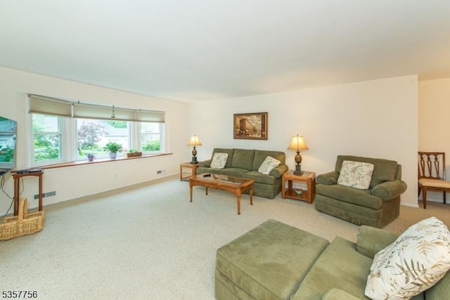 living area with carpet and baseboards