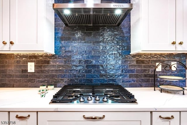 8 Sevell Cir Unit 8, Clark Twp, NJ 07066 - kitchen with wall chimney range hood, stainless steel gas cooktop, white cabinets, and backsplash