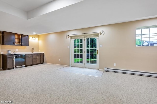 8 Sevell Cir Unit 8, Clark Twp, NJ 07066 - kitchen with light carpet, beverage cooler, a baseboard radiator, healthy amount of natural light, and recessed lighting