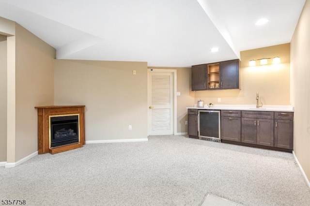 8 Sevell Cir Unit 8, Clark Twp, NJ 07066 - indoor wet bar with baseboards, light colored carpet, fridge, and recessed lighting