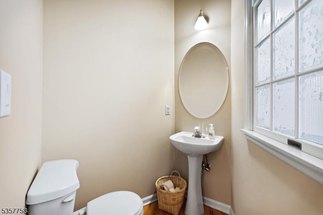 8 Sevell Cir Unit 8, Clark Twp, NJ 07066 - bathroom featuring toilet, plenty of natural light, baseboards, and wood finished floors