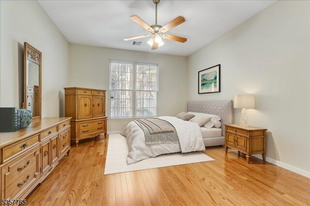 1302 Four Seasons Dr, Wayne Twp, NJ 07470 - bedroom featuring light wood-style flooring, baseboards, and ceiling fan