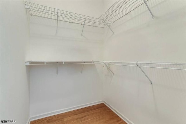 1302 Four Seasons Dr, Wayne Twp, NJ 07470 - spacious closet with wood finished floors
