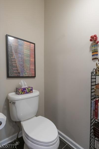 15 Riga Ct, Scotch Plains Twp, NJ 07076 - half bathroom with baseboards, toilet, and tile patterned flooring