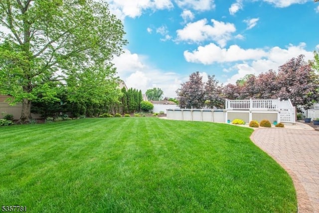 view of grassy yard with stairs