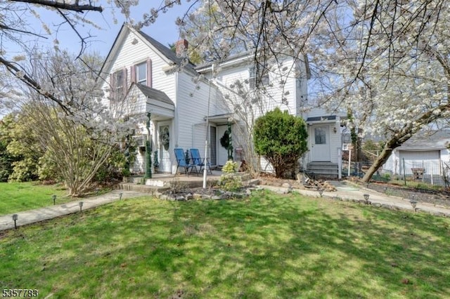 111 Long Hill Rd, Little Falls Twp, NJ 07424 - view of front of house with a front yard, a chimney, and entry steps