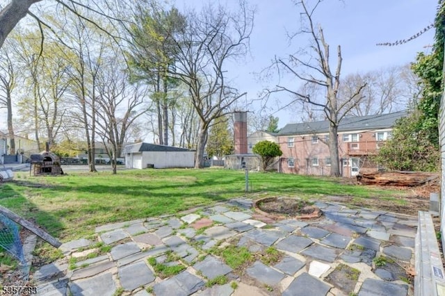 111 Long Hill Rd, Little Falls Twp, NJ 07424 - view of green lawn featuring a patio