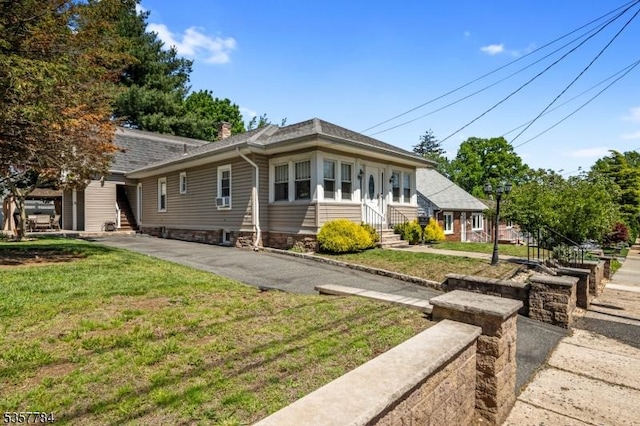 40 Laura Ave, Nutley Twp, NJ 07110 - view of front of house with entry steps, a chimney, and a front yard