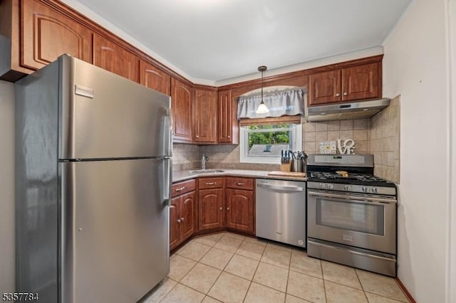 40 Laura Ave, Nutley Twp, NJ 07110 - kitchen featuring appliances with stainless steel finishes, under cabinet range hood, a sink, light tile patterned flooring, and tasteful backsplash