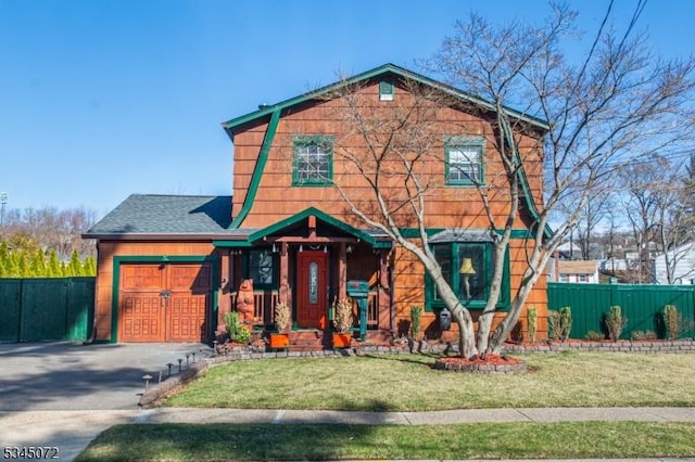 view of front of house with an attached garage and roof with shingles