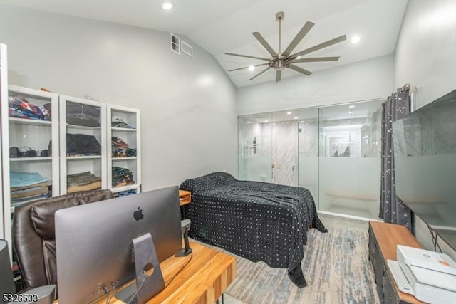 bedroom featuring lofted ceiling and a ceiling fan
