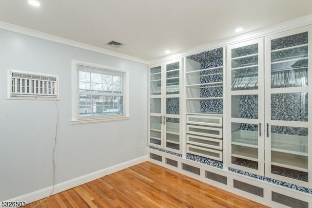 unfurnished sunroom featuring french doors and a wall unit AC