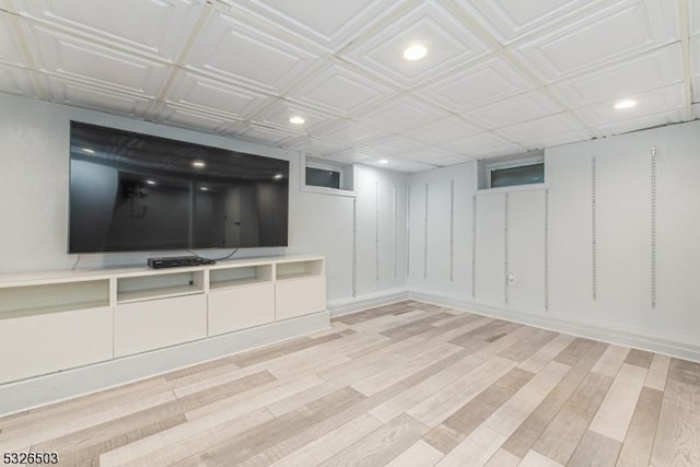 finished below grade area with recessed lighting and wood finished floors
