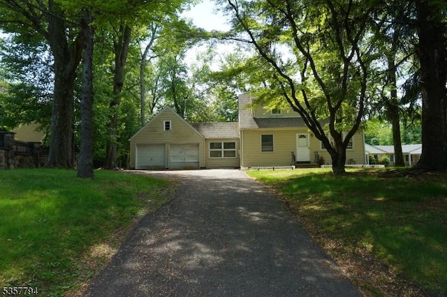 1620 Raritan Rd, Scotch Plains Twp, NJ 07076 - view of front of house with driveway, an attached garage, and a front lawn