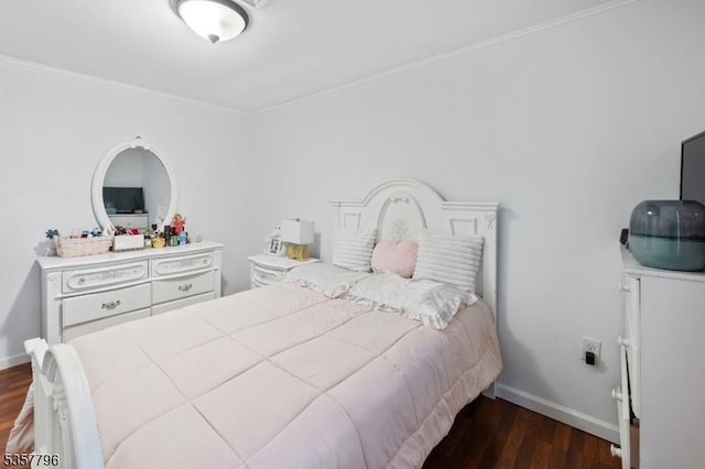 bedroom featuring dark wood-style floors, baseboards, and crown molding