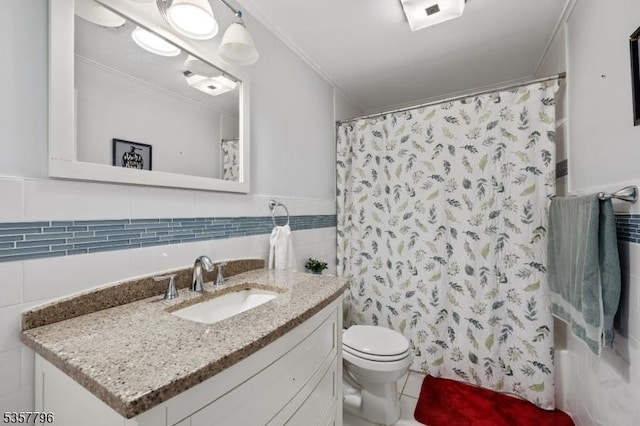 full bathroom with tile walls, toilet, vanity, and wainscoting
