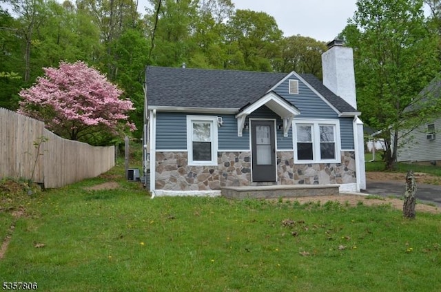 5 Fairview Ave, Mine Hill Twp, NJ 07803 - view of front of house with a chimney, central AC, stone siding, and a shingled roof