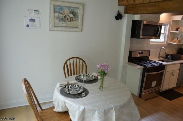 5 Fairview Ave, Mine Hill Twp, NJ 07803 - dining room with light wood-style floors, baseboards, and beamed ceiling