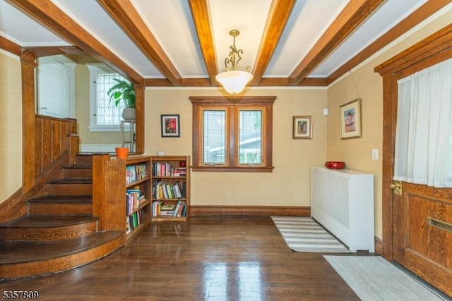 entrance foyer with wood-type flooring, baseboards, beam ceiling, and stairway