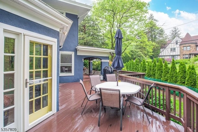 deck featuring outdoor dining area