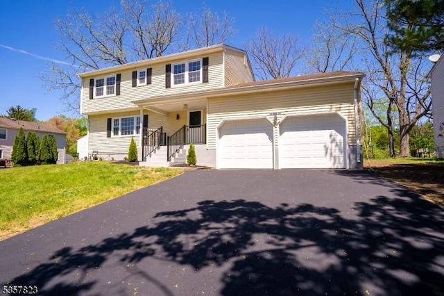 4 Harvey Rd, South Brunswick Twp, NJ 08852 - view of front of property featuring a garage, asphalt driveway, and a front yard