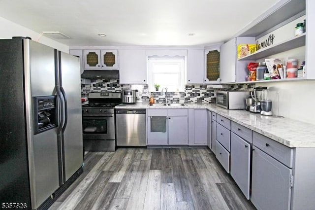 95 Richard St, Rockaway Twp, NJ 07801 - kitchen with stainless steel appliances, a sink, open shelves, under cabinet range hood, and gray cabinets