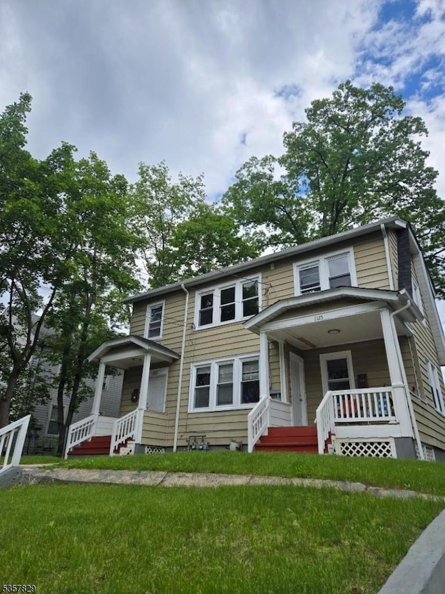 1123 W 4th St, Plainfield City, NJ 07063 - view of front of house featuring covered porch and a front lawn