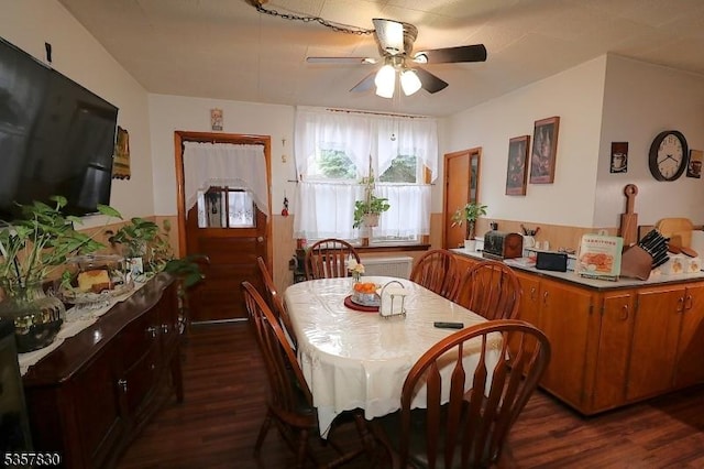 dining area featuring dark wood-style floors and a ceiling fan