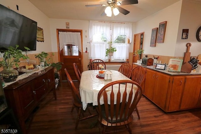 dining room featuring ceiling fan and dark wood finished floors